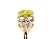 Fancy Yellow Cushion Cut Diamond Solitaire Ring Set in Yellow gold with Cluster Accents on Each Side