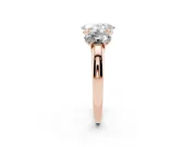 Oval Cut Diamond Three-Stone Ring Set in Rose gold with Bold Center and Classic Band
