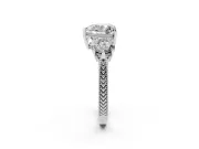 Heart Cut Diamond Three-Stone Ring Set in Platinum with Milgrain Band