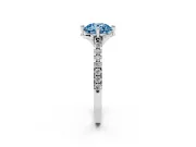 Fancy Blue Round Cut Diamond Solitaire Ring Set in Platinum with Pavé Band and Floral Prong Setting