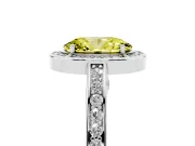 Fancy Yellow Oval Cut Diamond Halo Pavé Split Shank Ring Set in White gold with Prong Setting
