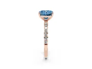 Fancy Blue Radiant Cut Diamond Solitaire Ring Set in Rose gold with Round Pavé Band and Prong Setting