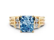 Fancy Blue Three-Stone Radiant Cut Diamond Channel Set Ring Set in Yellow gold with Bar Prongs