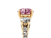 Fancy Pink Three-Stone Round Cut Diamond Pavé Band Ring Set in Yellow gold with Prong-Set Trio