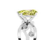 Fancy Yellow Pear Cut Diamond Solitaire Ring Set in White gold with Side Stones on Criss-Cross Band and Prong Setting