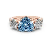 Fancy Blue Heart Cut Diamond Three-Stone Ring Set in Rose gold with Pavé Band