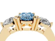 Fancy Blue Oval Cut Diamond Three-Stone Ring Set in Yellow gold with Prong Setting and Classic Band