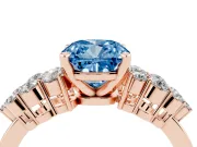Fancy Blue Cushion Cut Diamond Cluster Engagement Ring Set in Rose gold with Pavé Band and Prong Setting