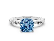 Fancy Blue Cushion Cut Diamond Solitaire Ring Set in Platinum with Twisted Band and Bead Prong Setting