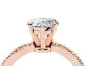 Heart Cut Diamond Solitaire Ring Set in Rose gold with Twisted Band and Bead Prong Setting