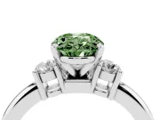Fancy Green Three-Stone Oval Cut Diamond Ring Set in Platinum with Prong Setting and Plain Band