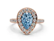 Fancy Blue Pear Cut Diamond Halo Pavé Engagement Ring Set in Rose gold with Bezel Setting