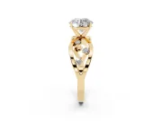 Round Cut Diamond Solitaire Ring Set in Yellow gold with Side Stones on Criss-Cross Band and Prong Setting