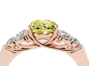 Fancy Yellow Oval Cut Diamond Cluster Ring Set in Rose gold with Round Accent Stones and Prong Setting on a Plain Band