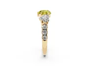 Fancy Yellow Heart Cut Diamond Three-Stone Ring Set in Yellow gold with Pavé Band