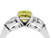 Fancy Yellow Three-Stone Emerald Cut Diamond Ring Set in White gold with Pear Side Stones and Prong Setting