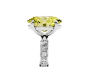 Fancy Yellow Oval Cut Diamond Solitaire Ring Set in White gold with Round Pavé Band and Prong Setting