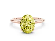 Fancy Yellow Oval Cut Diamond Solitaire Engagement Ring Set in Rose gold with Thin Band and Prong Setting