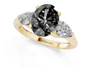 Fancy Black Three-Stone Oval Cut Diamond Ring Set in Yellow gold with Pear Side Stones and Prong Setting