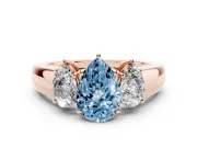 Fancy Blue Three-Stone Pear Cut Diamond Ring Set in Rose gold with Matching Prong Settings and Plain Band