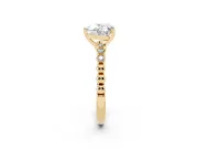 Heart Cut Diamond Solitaire Engagement Ring Set in Yellow gold with Bezel Accents on Beaded Band