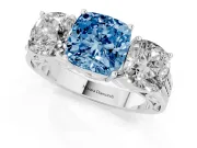 Fancy Blue Cushion Cut Diamond Three-Stone Ring Set in White gold with Textured Band