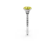 Fancy Yellow Round Cut Diamond Three-Stone Ring Set in Platinum with Pavé Band and Graduated Sides