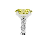 Fancy Yellow Oval Cut Diamond Solitaire Engagement Ring Set in Platinum with Bezel Accents on Beaded Band