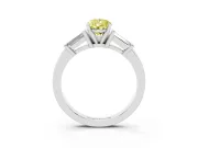 Fancy Yellow Pear Cut Diamond Solitaire Ring Set in White gold with Tapered Baguette Accents and Prong Setting