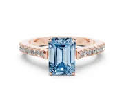 Fancy Blue Emerald Cut Diamond Solitaire Engagement Ring Set in Rose gold with Delicate Pavé Band and Prong Setting