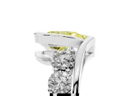 Fancy Yellow Pear Cut Diamond Bezel Bypass Ring Set in White gold with Round Accents
