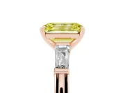 Fancy Yellow Emerald Cut Diamond Solitaire Ring Set in Rose gold with Tapered Baguette Side Stones and Prong Setting