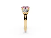 Fancy Pink Oval Cut Diamond Three-Stone Ring Set in Yellow gold with Prong Setting and Classic Band