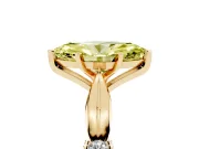 Fancy Yellow Marquise Cut Diamond Solitaire Twisted Band Ring Set in Yellow gold with Accent Stones and Prong Setting