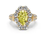 Fancy Yellow Pear Cut Diamond Halo Engagement Ring Set in Yellow gold with Split Shank and Prong Setting