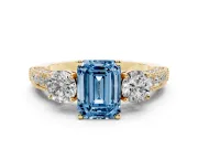 Emerald Cut Three Stone Engagement Ring Setting for a Fancy Blue Lab-Grown Diamond | Graduated Pave Band | Yellow Gold