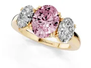 Fancy Pink Oval Cut Diamond Three-Stone Ring Set in Yellow gold with Polished Band and Prong Setting