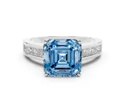 Fancy Blue Asscher Cut Diamond Solitaire Ring Set in Platinum with Channel-Set Band and Prong Setting