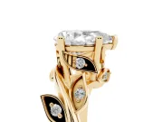 Pear Cut Diamond Solitaire Twist Engagement Ring Set in Yellow gold with Pavé Leaf Accents