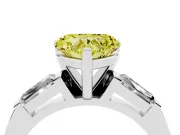 Fancy Yellow Heart Cut Diamond Solitaire Ring Set in Silver with Tapered Baguette Side Stones and Prong Setting
