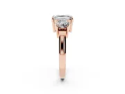 Emerald Cut Diamond Three-Stone Ring Set in Rose gold with Round Accent Stones and Plain Band