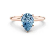 Fancy Blue Pear Cut Diamond Solitaire Ring Set in Rose gold with Cathedral Band and Prong Setting