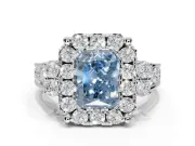 Radiant Cut Halo Engagement Ring Setting for a Fancy Blue Lab-Grown Diamond | Graduated Channel Band | Platinum