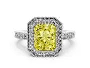 Fancy Yellow Radiant Cut Diamond Halo Engagement Ring Set in White gold with Pavé Band and Round Halo Stones