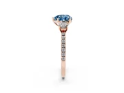 Fancy Blue Heart Cut Diamond Three-Stone Ring Set in Rose gold with Pavé Band and Graduated Sides