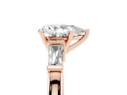 Pear Cut Diamond Solitaire Ring Set in Rose gold with Tapered Baguette Accents and Prong Setting