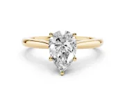 Pear Cut Diamond Solitaire Ring Set in Yellow gold with Cathedral Band and Prong Setting