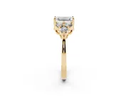 Emerald Cut Diamond Solitaire Ring Set in Yellow gold with Cluster Accents on Each Side