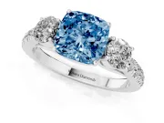 Fancy Blue Cushion Cut Diamond Three-Stone Ring Set in Silver with Round Side Stones and Delicate Pavé Band
