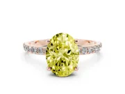 Fancy Yellow Oval Cut Diamond Solitaire Ring Set in Rose gold with Round Pavé Band and Prong Setting